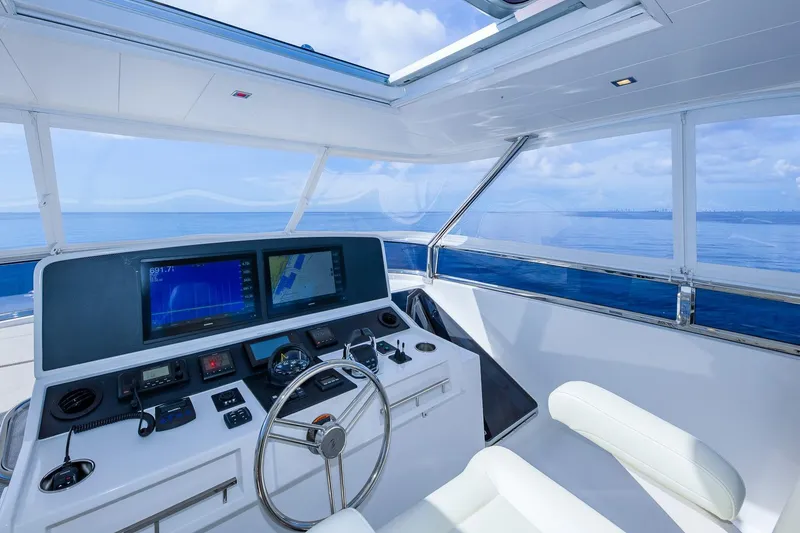 Slide: The Image of Luxurious 2019 Regency P65 yacht helm with modern navigation systems and ocean view. - 18