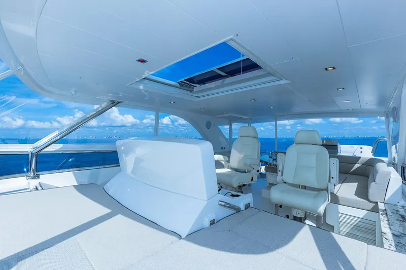 Slide: The Image of Luxurious 2019 Regency P65 yacht interior with plush seating and ocean view. - 20
