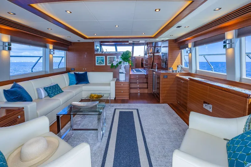 Slide: The Image of Luxurious 2019 Regency P65 yacht interior with elegant seating, ocean views, and modern decor. - 28
