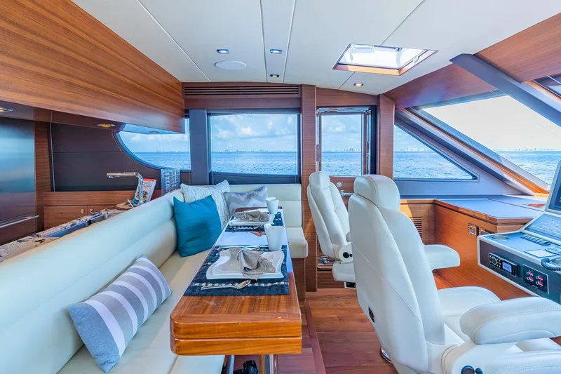 Slide: The Image of Luxurious 2019 Regency P65 yacht interior with elegant seating and ocean view. - 33