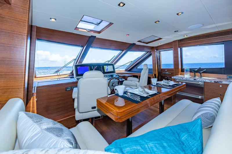 Slide: The Image of Luxurious 2019 Regency P65 yacht interior with elegant dining and navigation area. - 38