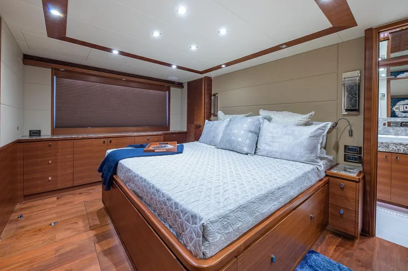 Slide: The Image of Luxurious bedroom interior of 2019 Regency P65 yacht with elegant wood finishes. - 47