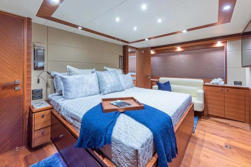Slide: The Image of Luxurious bedroom interior of 2019 Regency P65 yacht with elegant wood finishes. - 48