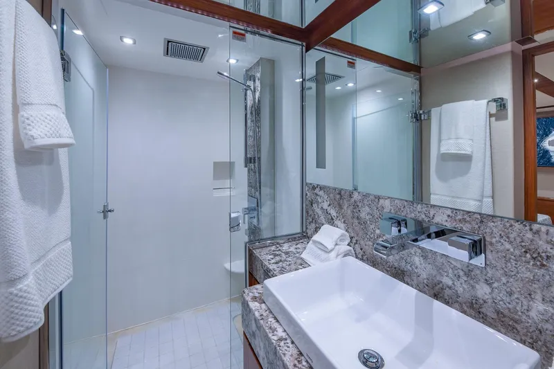 Slide: The Image of Luxurious bathroom in 2019 Regency P65 yacht with modern fixtures and elegant design. - 52