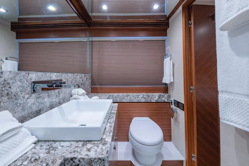 Slide: The Image of Luxurious bathroom in 2019 Regency P65 yacht with modern fixtures and elegant design. - 53