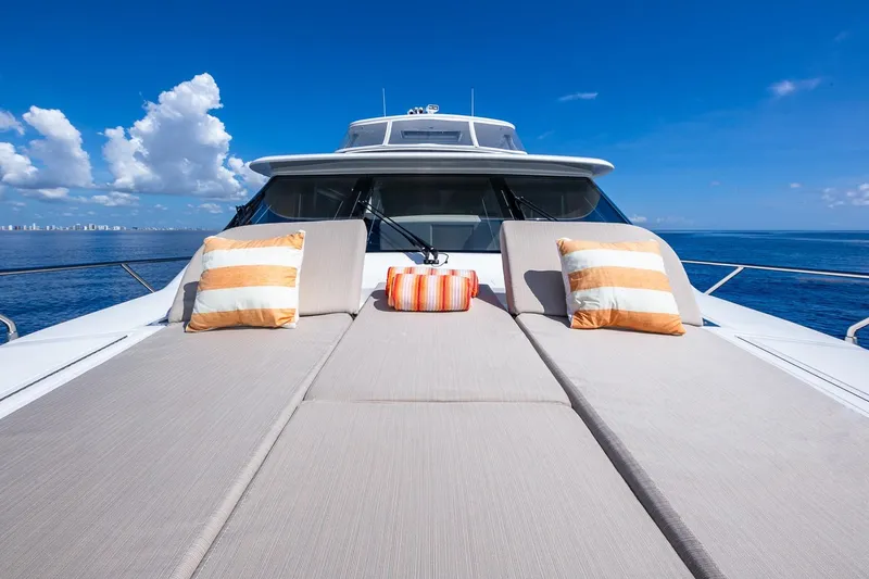 Slide: The Image of Luxurious 2019 Regency P65 yacht deck with cushions, ocean view, and blue sky. - 7