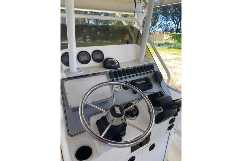 Slide: The Image of Steering console of a 2000 Novurania 21 boat with gauges and controls. - 4