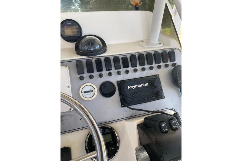 Slide: The Image of Control panel of a 2000 Novurania 21 boat with Raymarine equipment. - 5