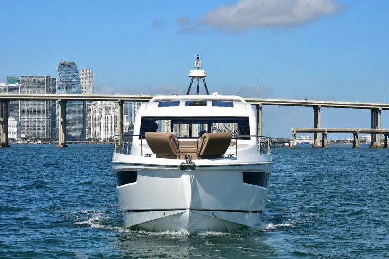 Slide: The Image of 2022 Sealine C430 yacht cruising near city skyline and bridge. - 17