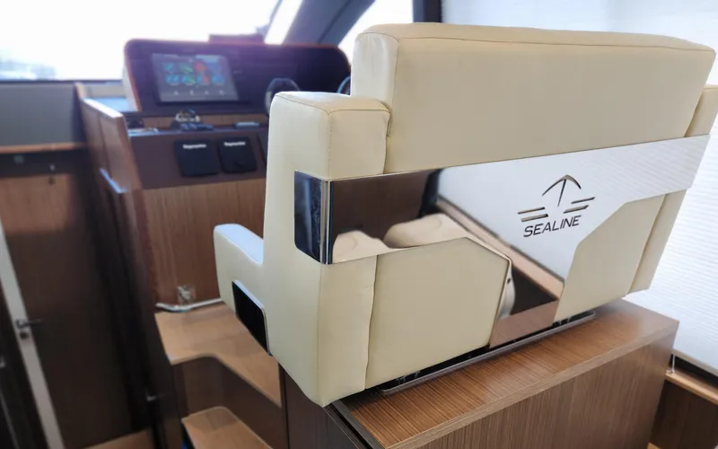 Slide: The Image of Sealine C430 2022 yacht interior with modern helm and luxurious seating. - 40