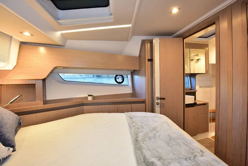 Slide: The Image of Luxurious interior of 2022 Sealine C430 yacht cabin with modern design and cozy bedding. - 47