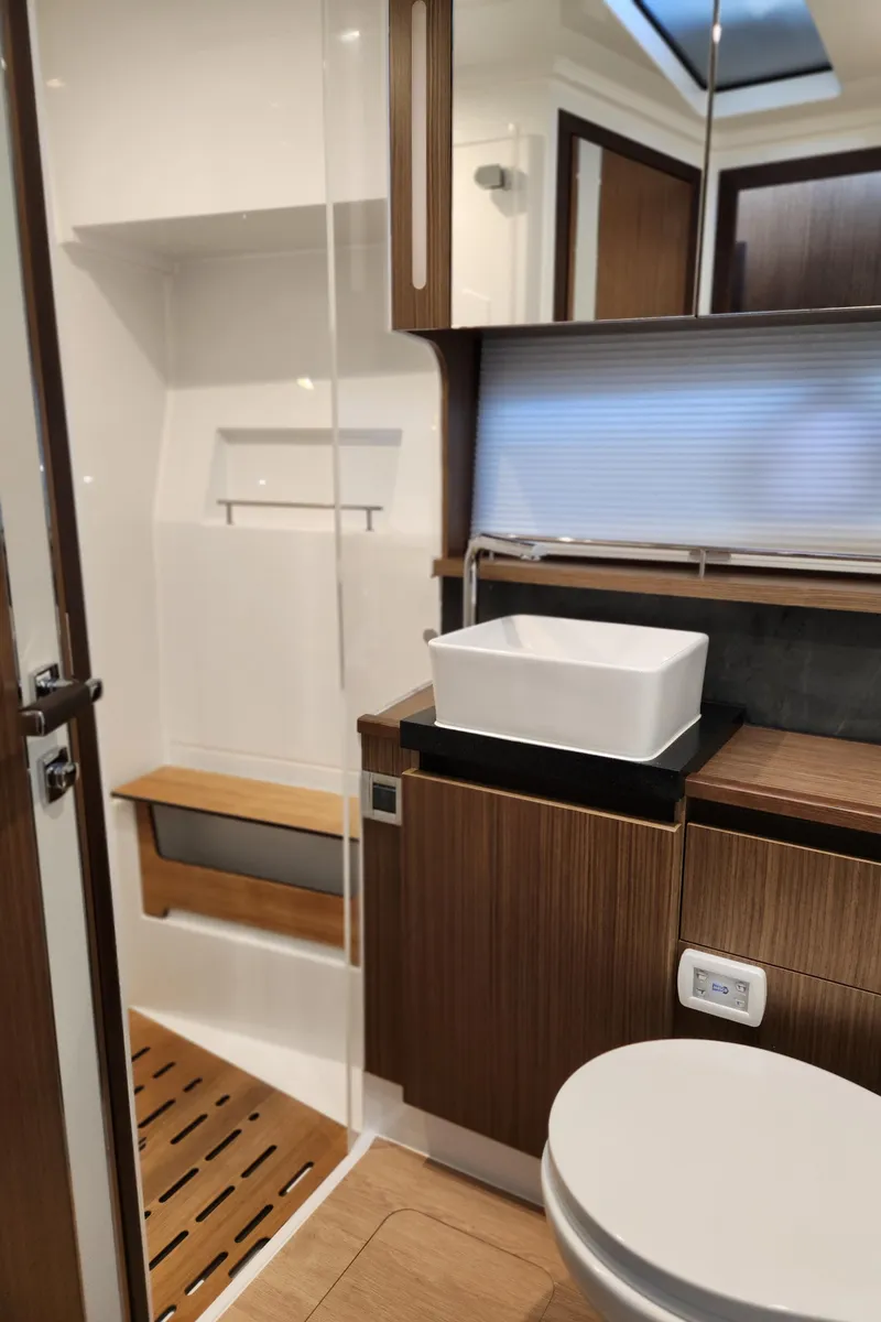 Slide: The Image of 2022 Sealine C430 yacht bathroom with modern fixtures and wooden accents. - 50