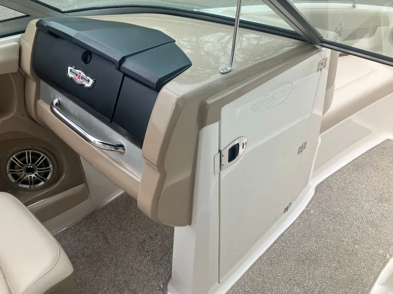 Slide: The Image of Interior of 2011 Chaparral 216 SSi with speaker and storage compartment. - 14