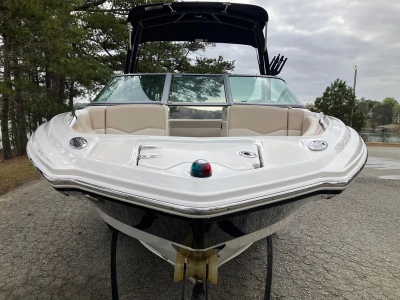 Slide: The Image of 2011 Chaparral 216 SSi boat parked, front view. - 2
