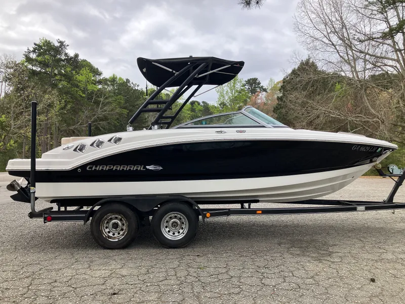 Slide: The Image of 2011 Chaparral 216 SSi boat on trailer outdoors. - 4