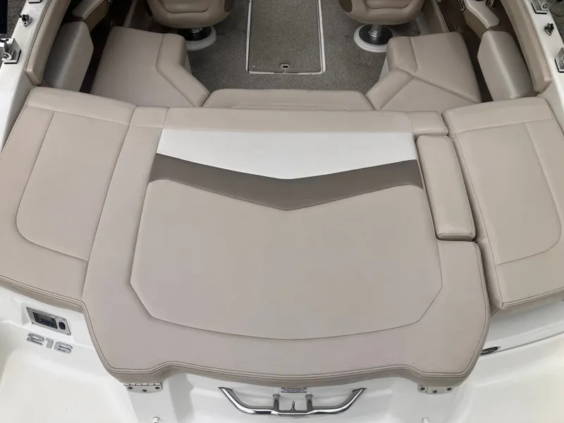 Slide: The Image of Interior of a 2011 Chaparral 216 SSi boat with beige upholstery. - 8