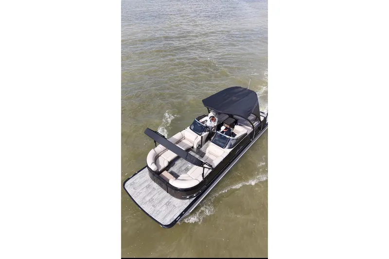 The Image of 2022 Avalon Catalina Platinum Cruise pontoon boat on water, featuring sleek design and spacious seating. - 0