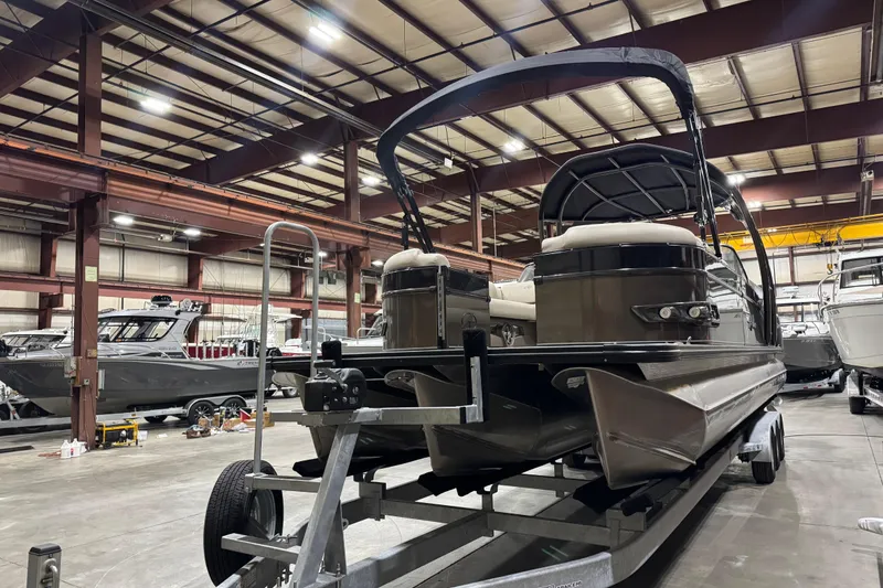Slide: The Image of 2022 Avalon Catalina Platinum Cruise pontoon boat in a warehouse setting. - 11