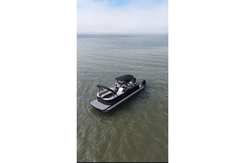 Slide: The Image of 2022 Avalon Catalina Platinum Cruise pontoon boat on calm water. - 2