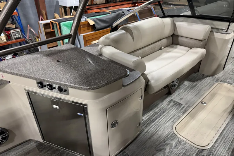 Slide: The Image of 2022 Avalon Catalina Platinum Cruise interior with seating and storage, showcasing luxury design. - 27