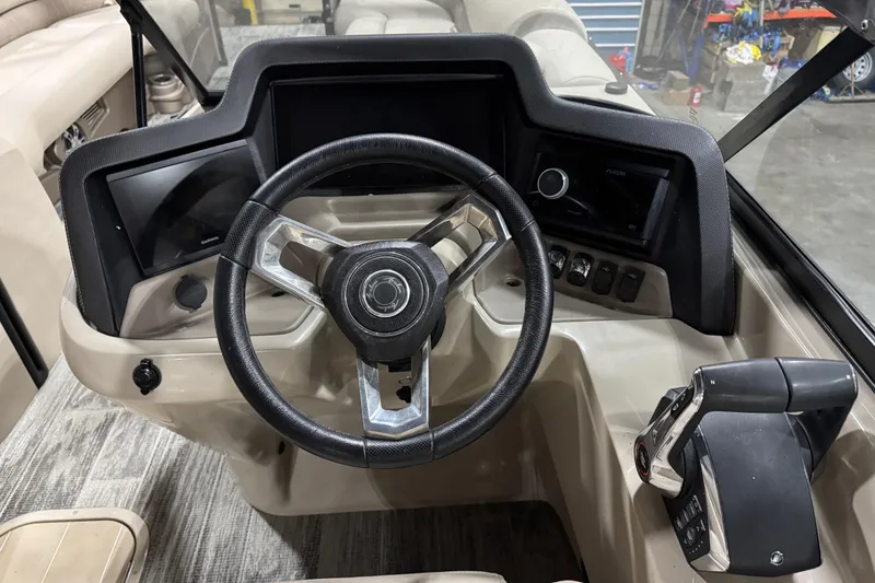 Slide: The Image of 2022 Avalon Catalina Platinum Cruise dashboard with steering wheel and controls. - 28