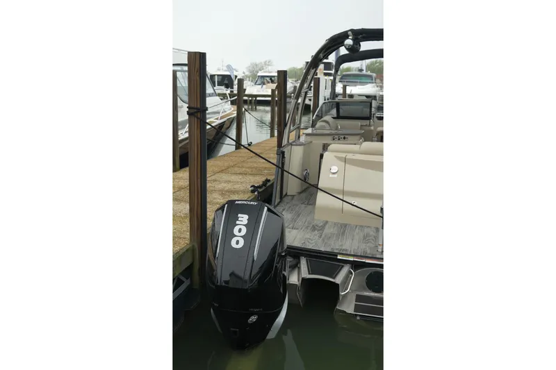 Slide: The Image of 2022 Avalon Catalina Platinum Cruise boat with Mercury 300 engine docked at marina. - 37