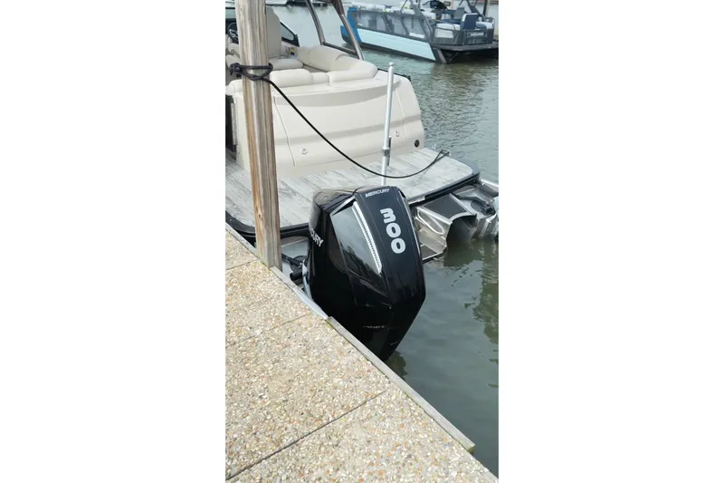 Slide: The Image of 2022 Avalon Catalina Platinum Cruise with Mercury 300 outboard motor docked at marina. - 38