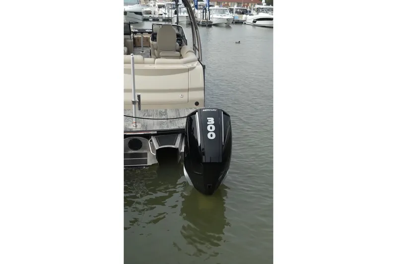 Slide: The Image of 2022 Avalon Catalina Platinum Cruise with Mercury 300 outboard motor at marina. - 39