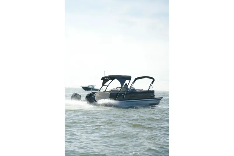 Slide: The Image of 2022 Avalon Catalina Platinum Cruise pontoon boat cruising on open water. - 4