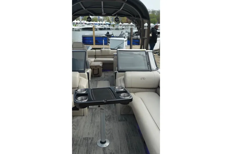 Slide: The Image of 2022 Avalon Catalina Platinum Cruise boat interior with luxurious seating and cup holders. - 42