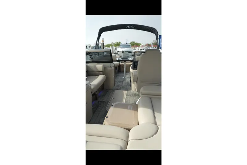 Slide: The Image of 2022 Avalon Catalina Platinum Cruise boat interior with beige seating and modern design. - 44