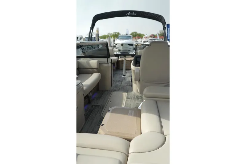 Slide: The Image of 2022 Avalon Catalina Platinum Cruise boat interior with beige seating and modern design. - 45
