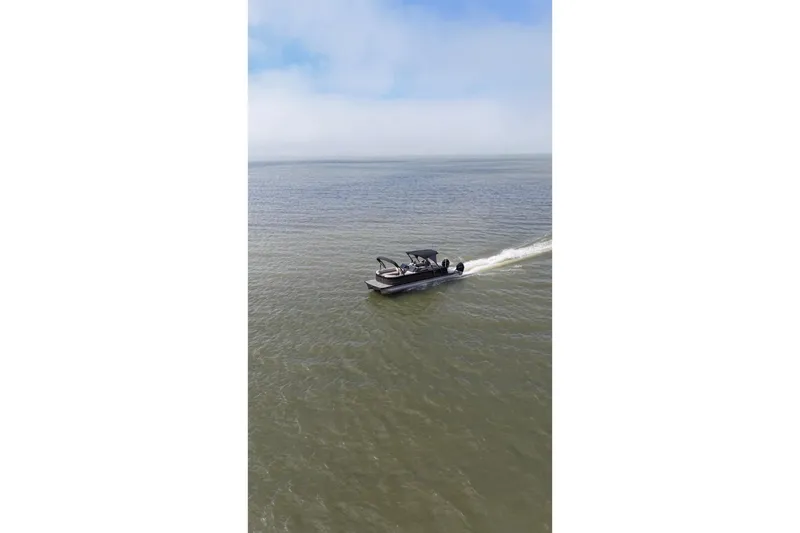 Slide: The Image of 2022 Avalon Catalina Platinum Cruise boat gliding on open water under a clear sky. - 5