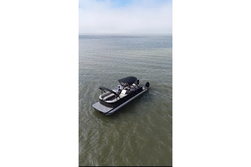 Slide: The Image of 2022 Avalon Catalina Platinum Cruise pontoon boat on calm water. - 50