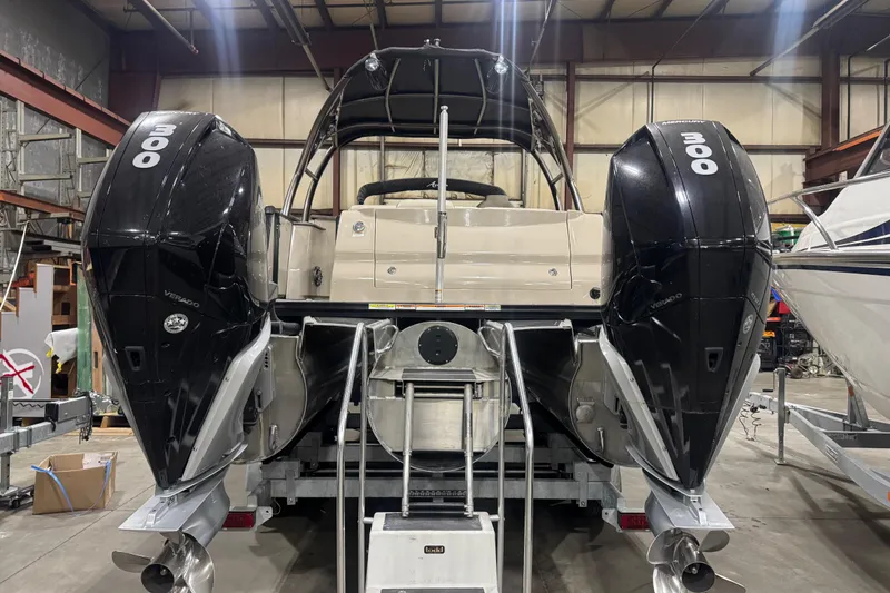Slide: The Image of 2022 Avalon Catalina Platinum Cruise with dual 300 horsepower engines in a warehouse setting. - 7