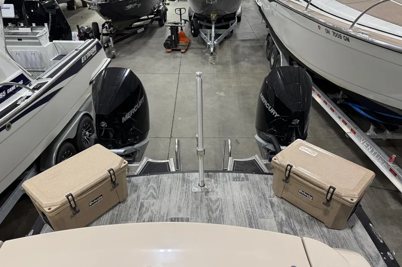 Slide: The Image of 2022 Avalon Catalina Platinum Cruise boat with dual Mercury engines and coolers on deck. - 12