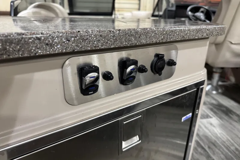 Slide: The Image of Control panel on 2022 Avalon Catalina Platinum Cruise boat with granite countertop. - 16