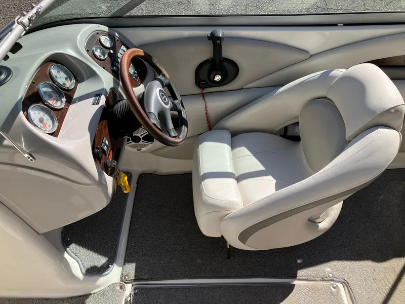 Slide: The Image of Interior of a 2008 Chaparral 204 SSi boat with steering wheel and dashboard. - 11