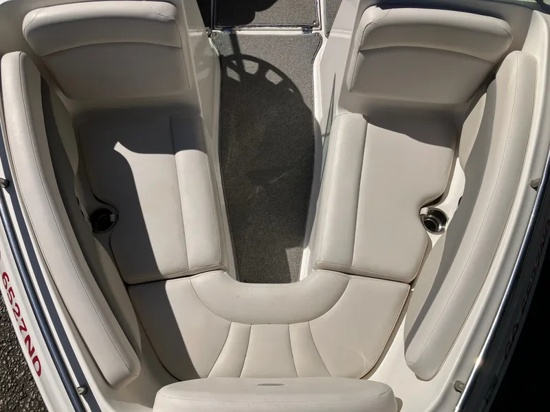 Slide: The Image of Interior of a 2008 Chaparral 204 SSi boat with beige seating. - 15