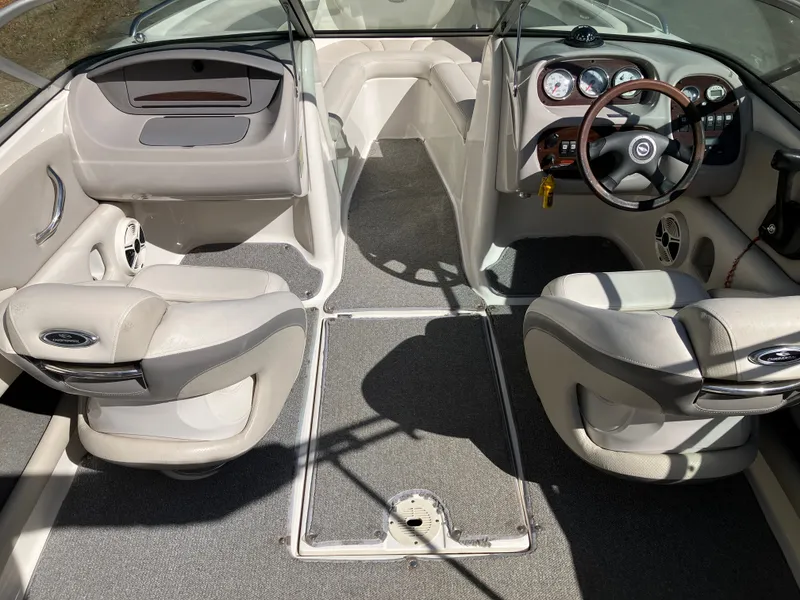 Slide: The Image of Interior of a 2008 Chaparral 204 SSi boat with steering wheel and seats. - 9