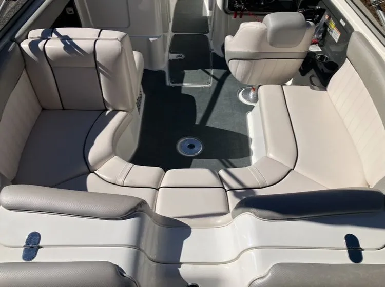 Slide: The Image of Interior of a 2009 Yamaha SX230 boat with gray seating. - 10