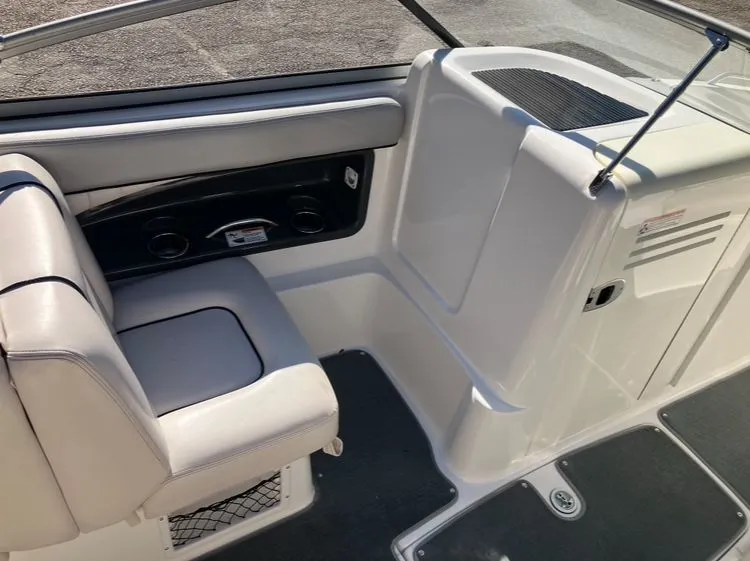 Slide: The Image of Interior of a 2009 Yamaha SX230 boat with seating and storage. - 13