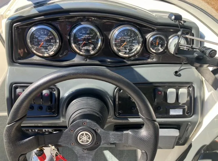 Slide: The Image of Dashboard of a 2009 Yamaha SX230 boat with gauges. - 15