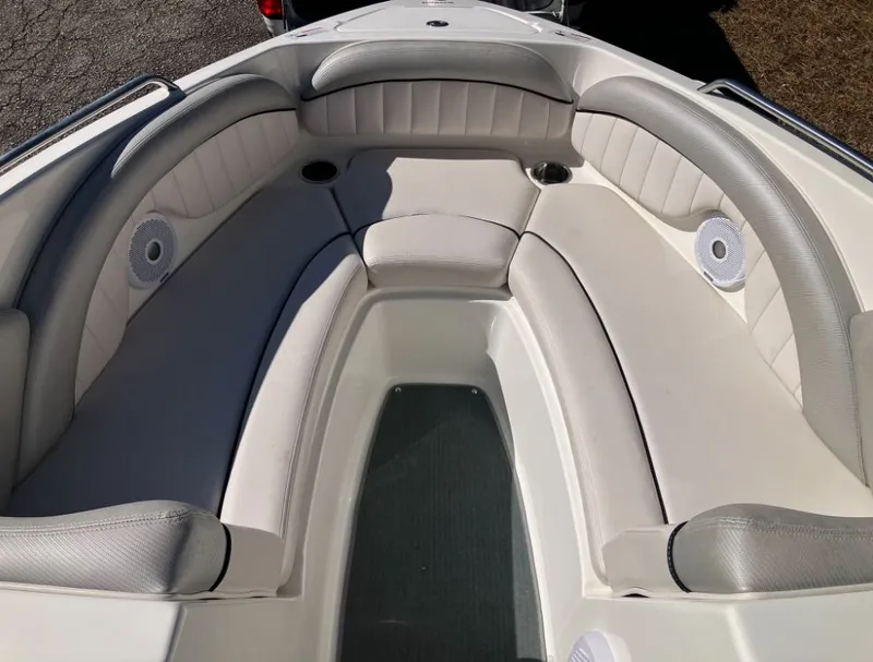 Slide: The Image of Interior of a 2009 Yamaha SX230 boat with cushioned seating. - 18