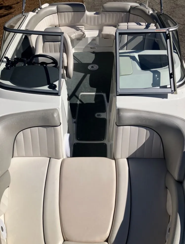 Slide: The Image of Interior of a 2009 Yamaha SX230 boat with beige seating. - 20