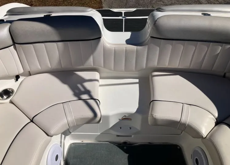 Slide: The Image of Interior of a 2009 Yamaha SX230 boat with white upholstery. - 23