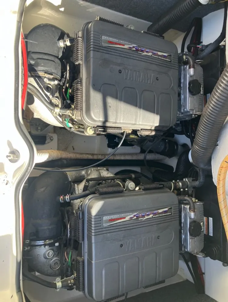 Slide: The Image of Engine compartment of a 2009 Yamaha SX230 boat with dual engines. - 25