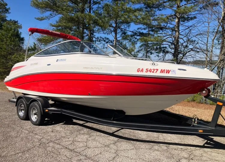 Slide: The Image of 2009 Yamaha SX230 boat on trailer outdoors. - 3