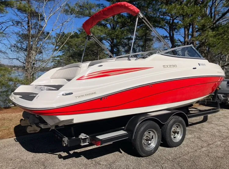 Slide: The Image of 2009 Yamaha SX230 boat on trailer, red and white design. - 5