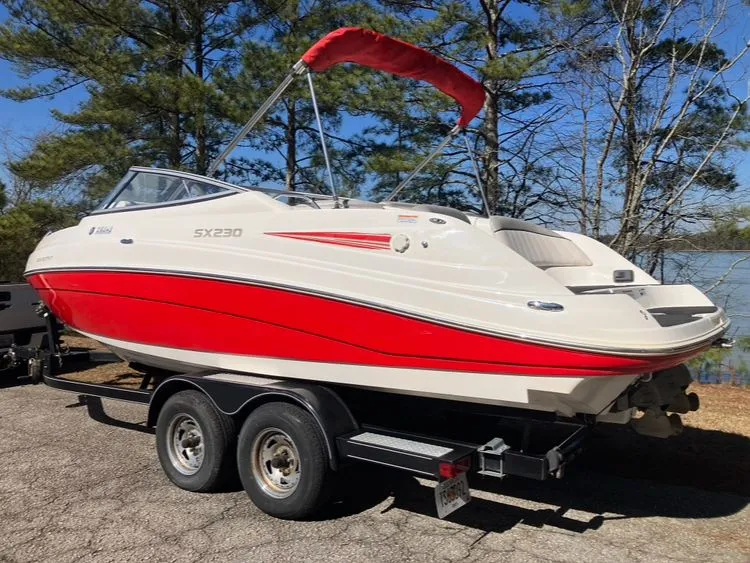 Slide: The Image of 2009 Yamaha SX230 boat on trailer, red and white design. - 7